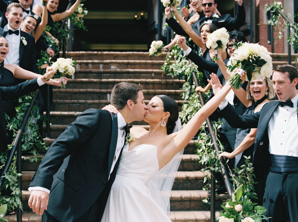 Wedding couple kissing at St. Brigid Catholic Church, Johns Creek, GA