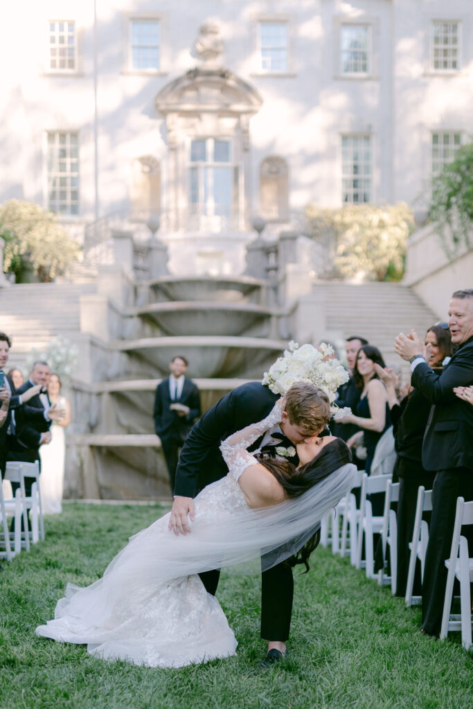 Wedding couple kissing in front of Swan House Fountains in Atlanta, GA