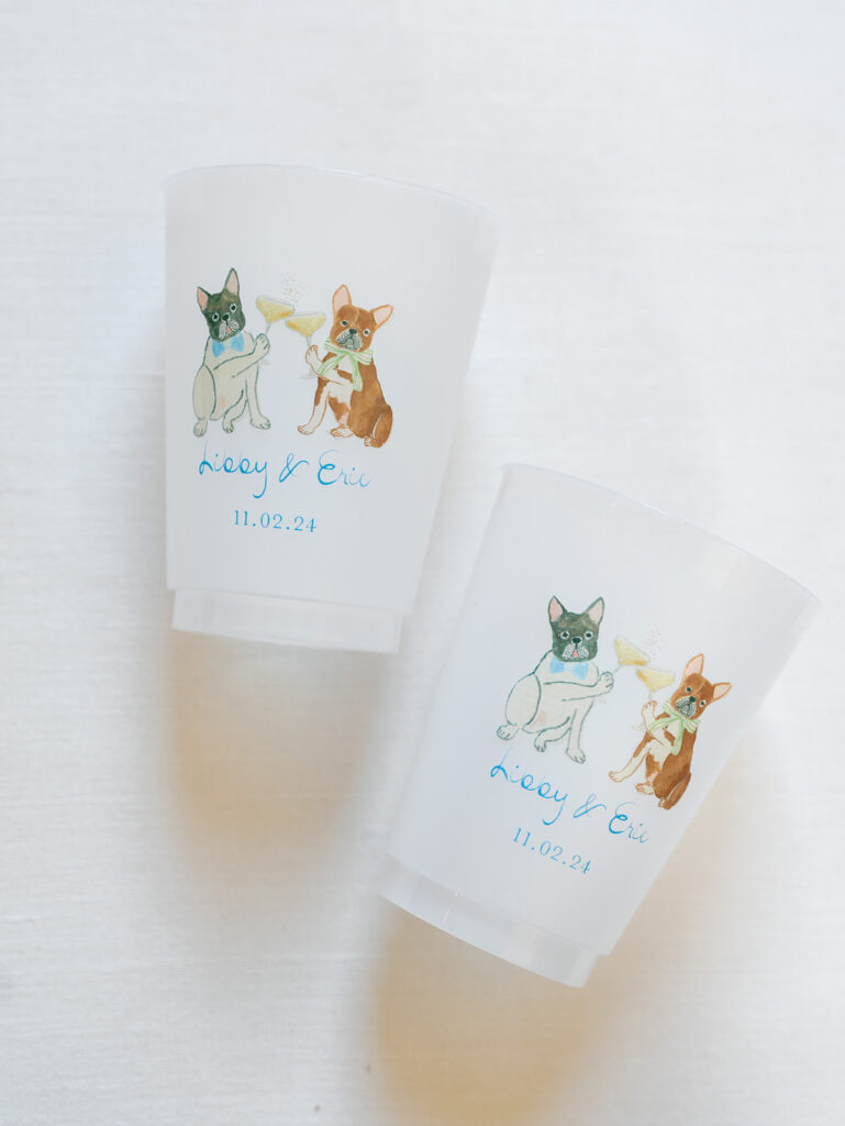 wedding cups with drawings of the wedding couples dogs