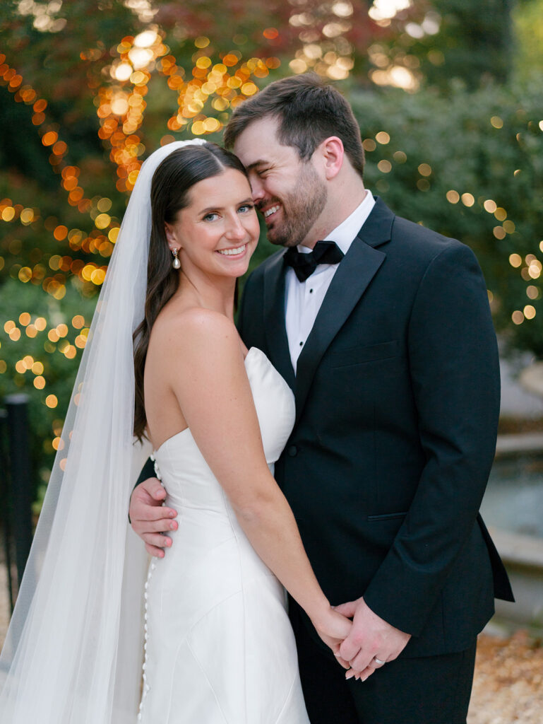 bride and groom holding hands and smiling